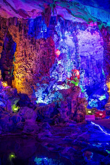 The beautifully illuminated Reed flute cave displaying stalactite formations