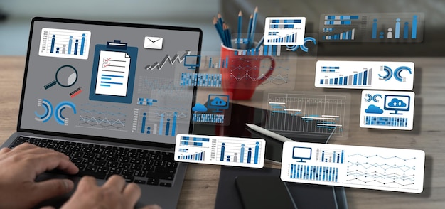 using a computer an analysis businessman working at a home office while standing at a desk is the data marketing management system datum analytics chart and graph dashboard