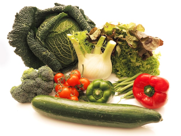 variety of fresh vegetables over white background