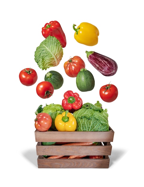vegetables flying in wooden box isolated from the background