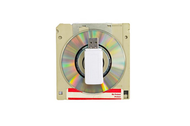 vintage retro electronic data storage External memory in Computer Organization devices from 80s 90s cd disk flash drives Stack floppy disks selective focus