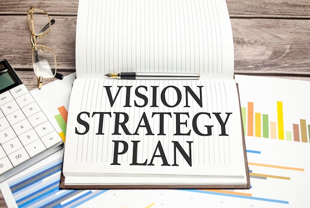 vision strategy plan words on notepad and charts
