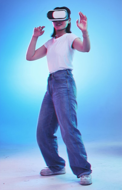 vr glasses and woman fight gaming and action video for user experience metaverse or high technology virtual reality digital world and person in 3d fantasy or scifi game on blue studio background