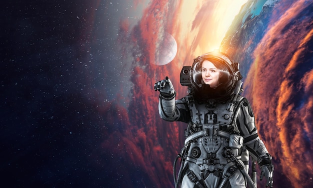 woman astronaut at spacewalk on planet orbit.