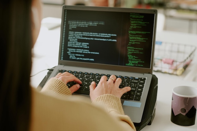 Woman Coding on laptop