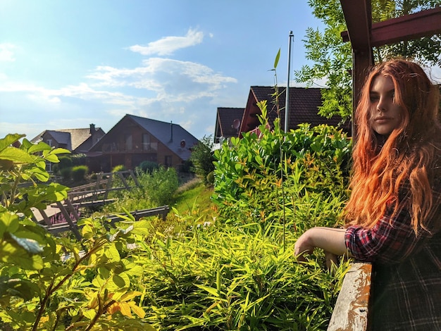 Woman in building against sky