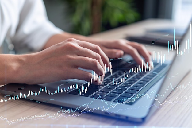 woman typing the keyboard to research stock market to proceed right investment solutions internet trading and wealth management concept formal wear hologram forex chart over close up shot