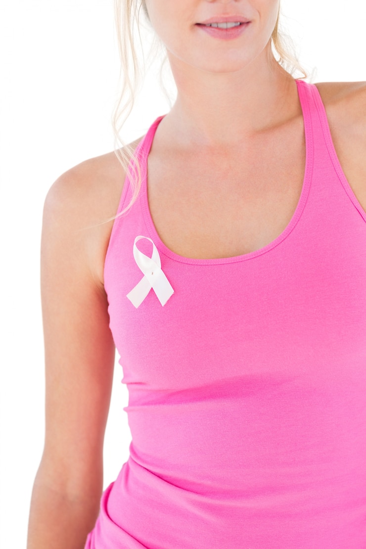Fotografie woman wearing pink top and breast cancer ribbon