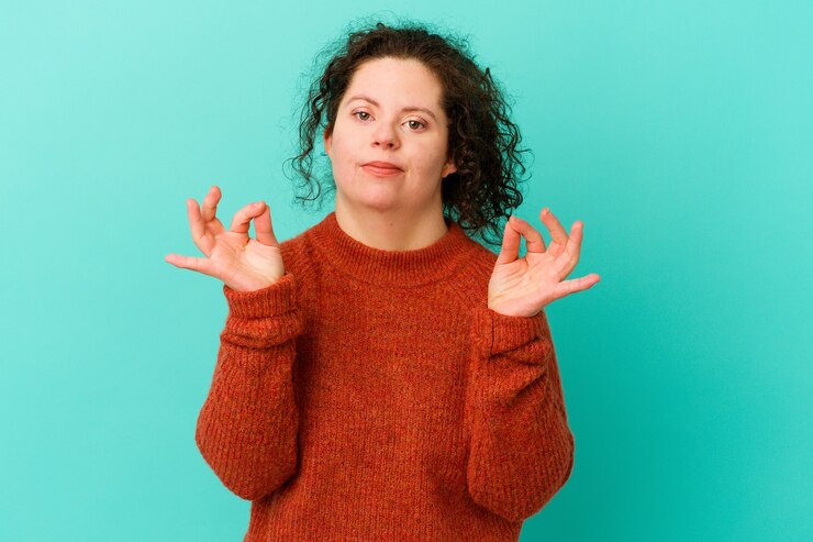 Fotografie woman with down syndrome isolated cheerful and confident showing ok gesture