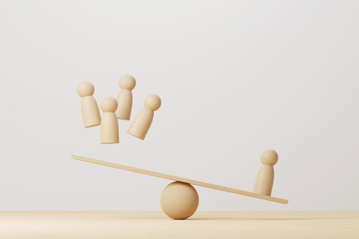Fotografie wooden human compared balancing on wood scale seesaw. 3d illustration