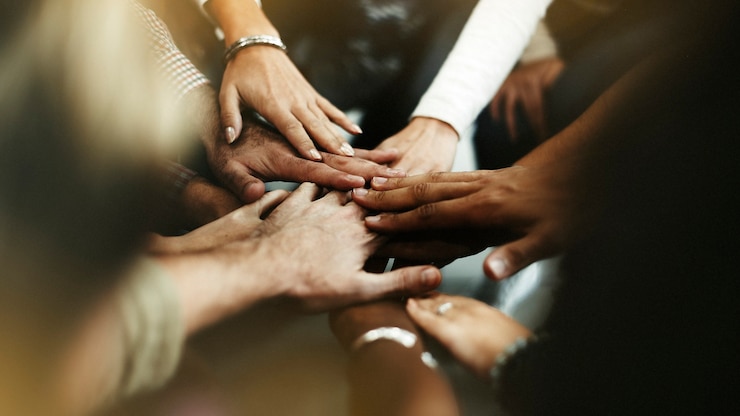 Zdarma Fotografie closeup of diverse people joining their hands