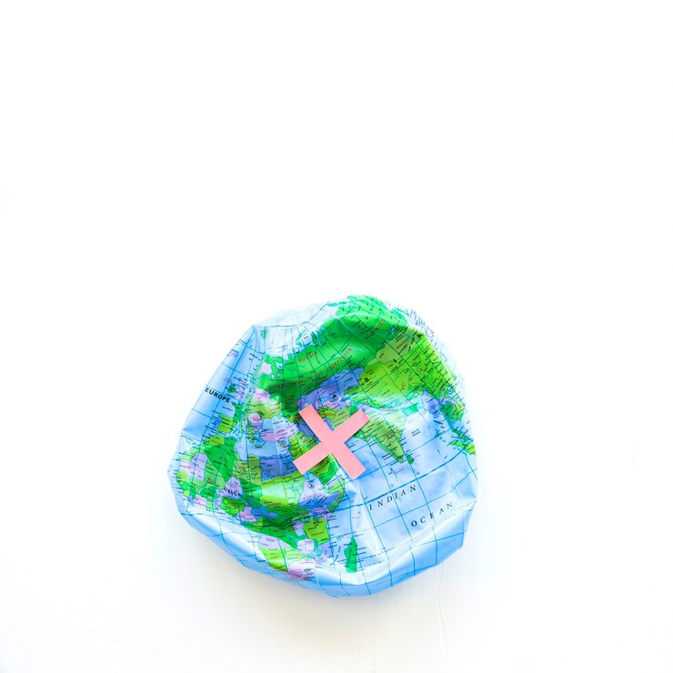 Zdarma Fotografie deflated earth ball and cross