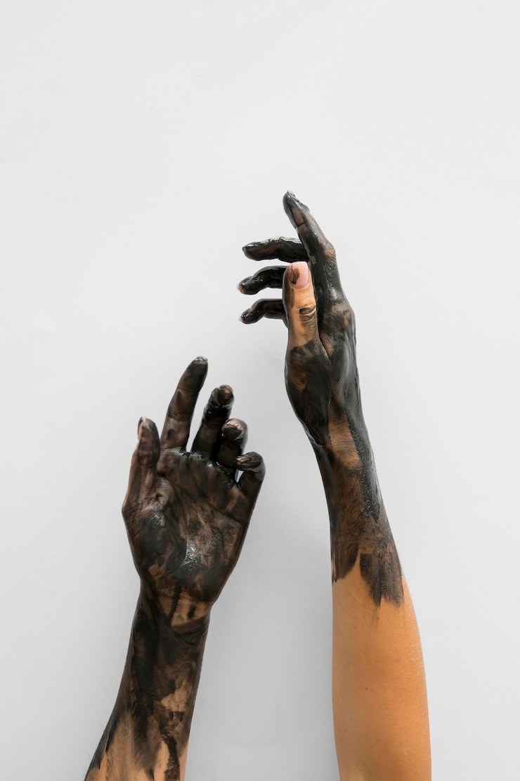 Zdarma Fotografie front view of hands covered in black paint with copy space