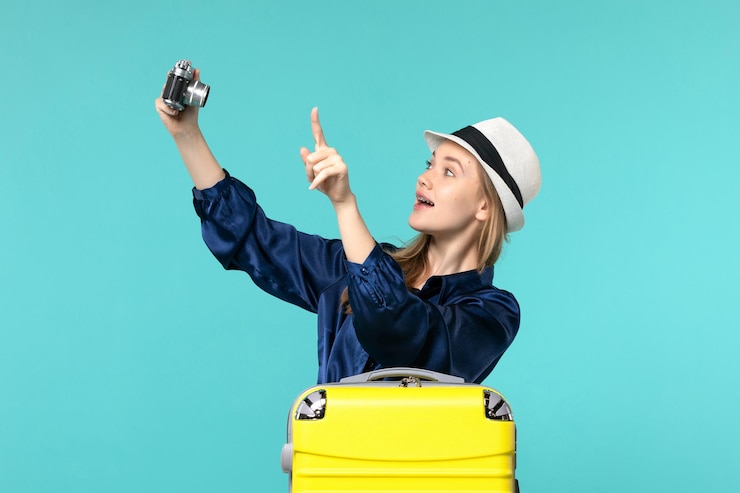 Zdarma Fotografie front view young woman taking photos with camera on blue background woman journey sea voyage plane