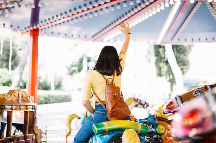 Zdarma Fotografie girl on a carrousel