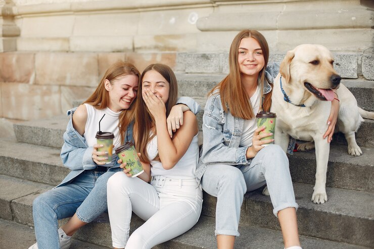 Zdarma Fotografie girls sitting on a staircase with cute dog