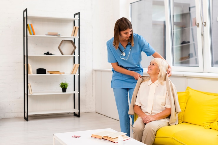 Zdarma Fotografie long shot nurse helping old woman with her coat