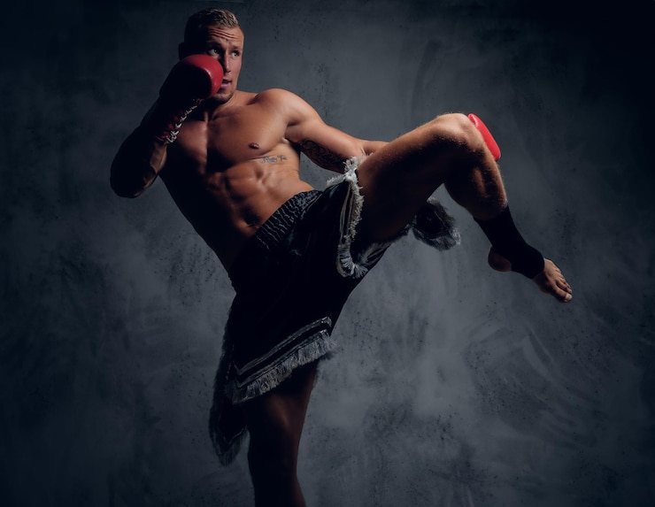 Zdarma Fotografie male fighter in action. leg kicking.