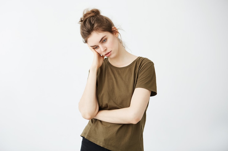 Zdarma Fotografie portrait of displeased bored tired woman with bun.