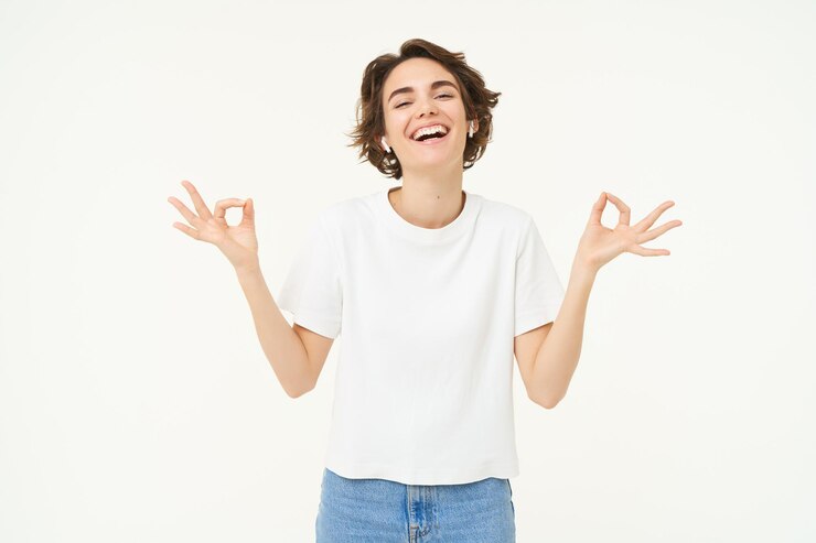Zdarma Fotografie portrait of young woman feeling peace and relaxation holding hands sideways zen gesture meditating