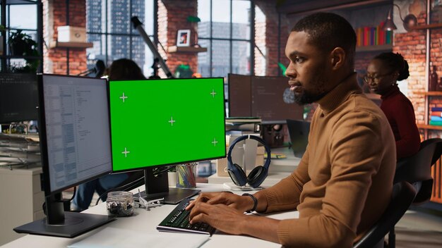 Programmer coding in AI startup office using isolated screen PC