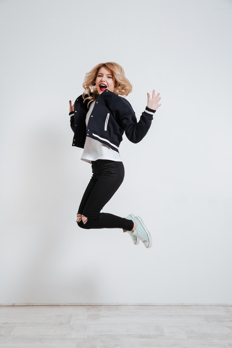 Zdarma Fotografie young happy woman jumping and celebrating success