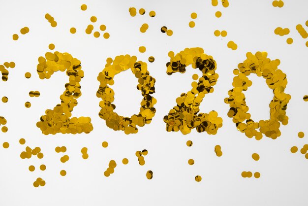 Foto grátis 2020 ano novo dígitos lantejoulas douradas