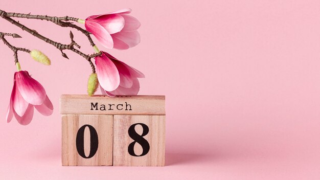 8 de março vista frontal letras com flores cor de rosa e espaço de cópia