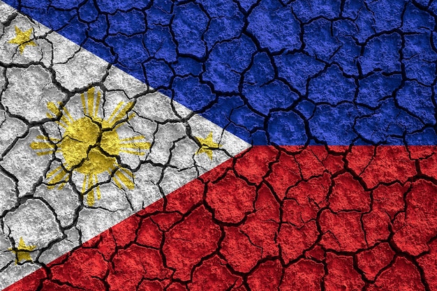 Bandeira da república das filipinas em fundo de textura de solo de terra seca