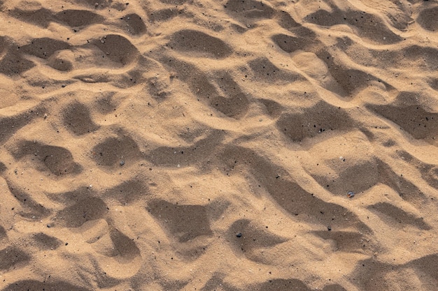 Bela areia natural de fundo de praia ao pôr do sol