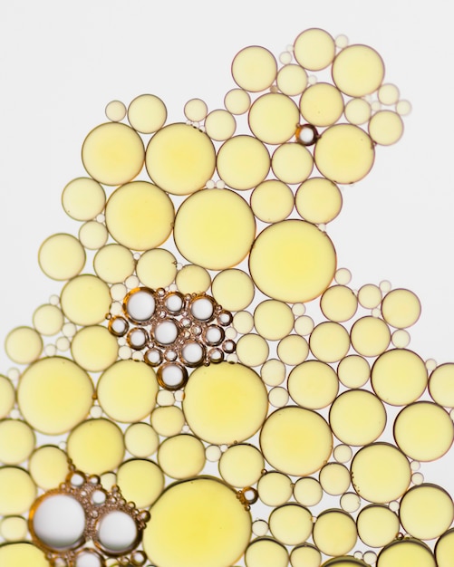 Bolhas douradas abstratas do close-up