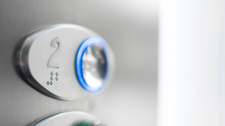 Foto grátis botão elevador de close-up com braille