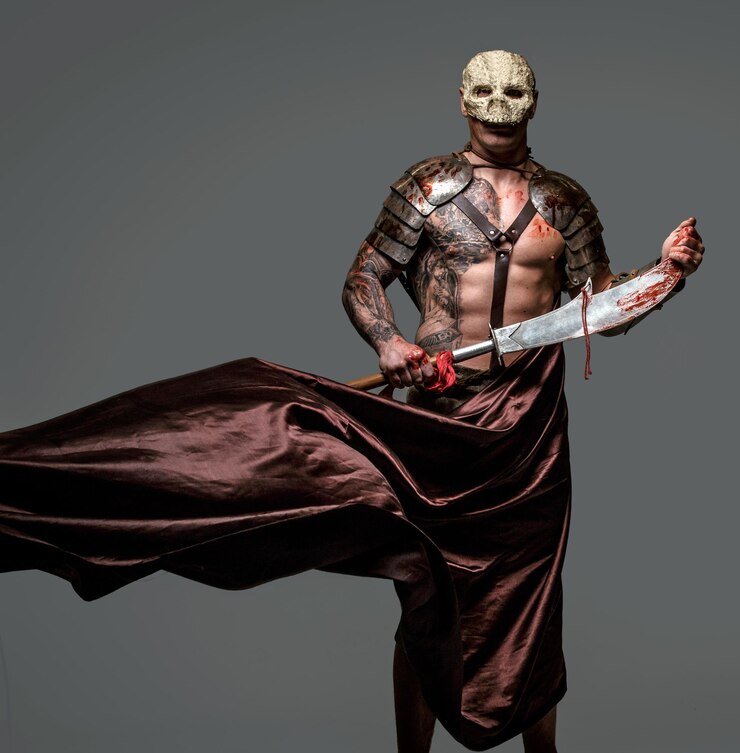 Foto grátis brutal perigoso lutador medievel tatuado em máscara de caveira em armadura