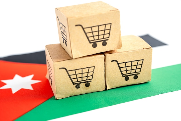 Caixa com logotipo do carrinho de compras e bandeira da jordânia import export compras on-line ou finanças de comércio eletrônico