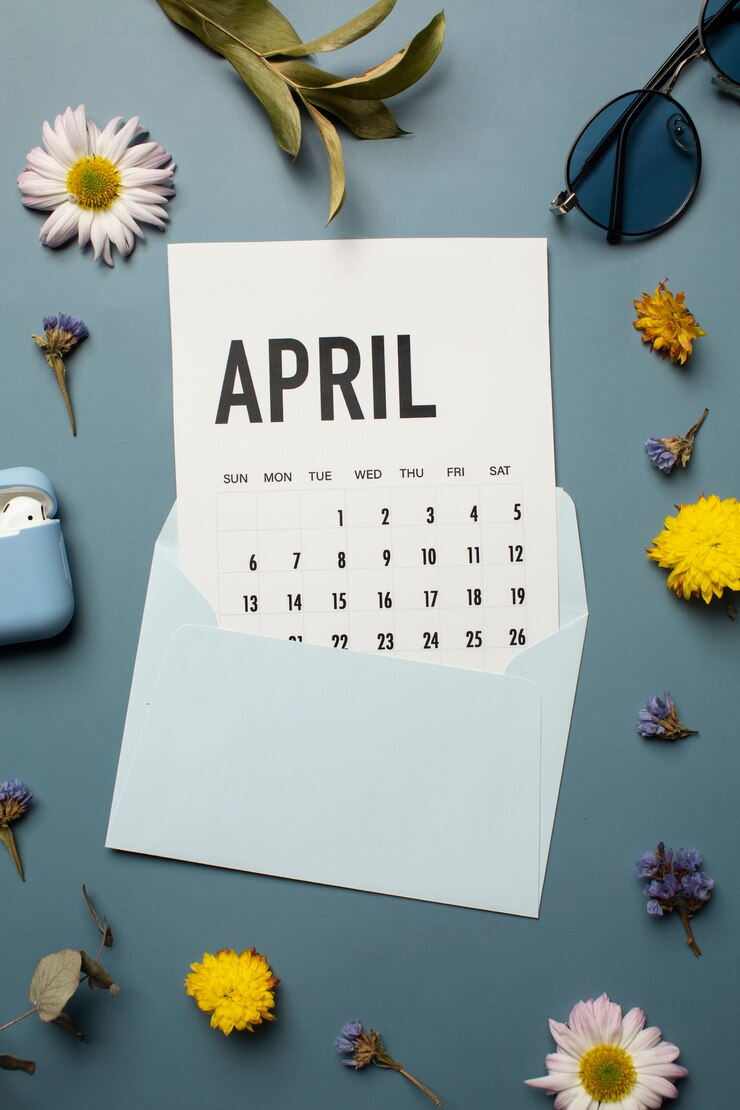 Foto grátis calendário e flores de abril plano