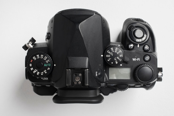 Foto grátis câmera de fotografia de top view em ambientes fechados