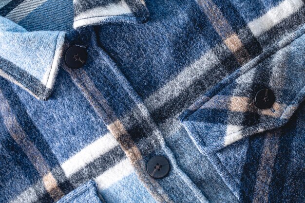 Camisa xadrez azul textural quente de outono closeup