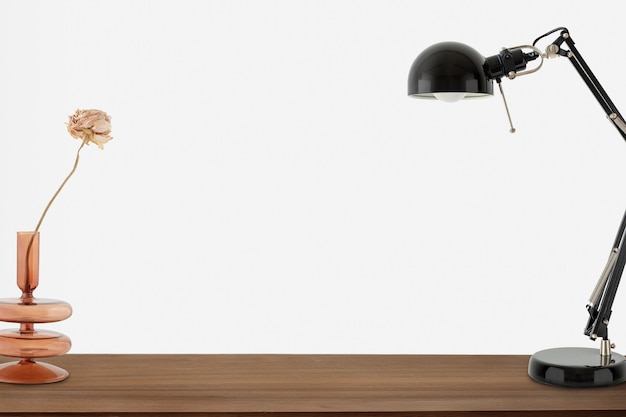 Candeeiro de mesa preto sobre uma mesa de madeira