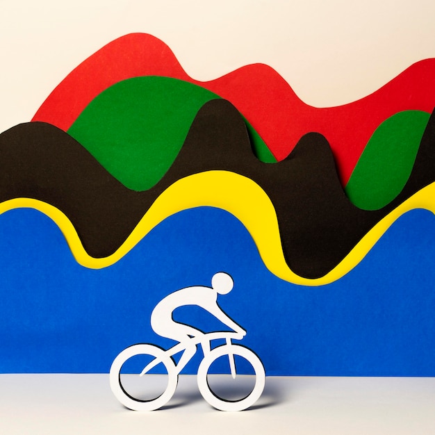 Foto grátis ciclista de papel com ondas coloridas abstratas