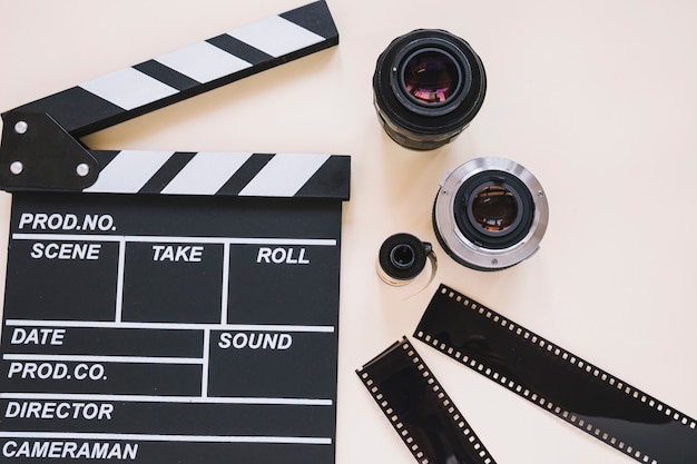 Clapperboard, lentes de câmera e bobinas de filme