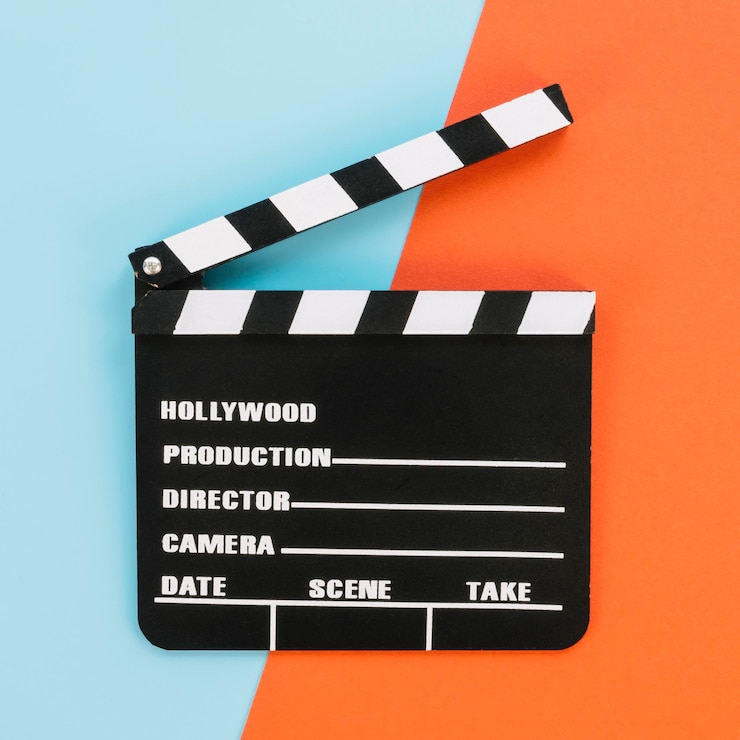 Foto grátis claquete de hollywood vista superior em cima da mesa