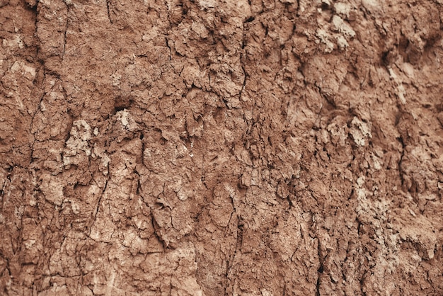 Close-up da textura e do fundo da montanha de pedra marrom natural