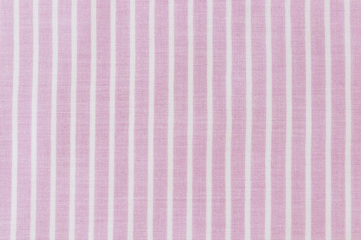 Foto grátis close-up, de, cor-de-rosa, pano, textura, fundo