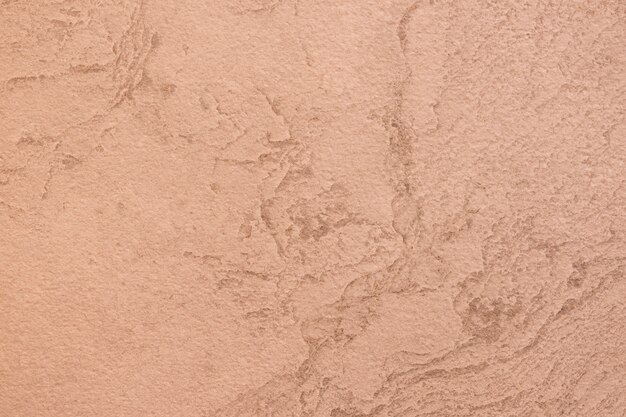 Close-up de uma textura de parede áspera laranja