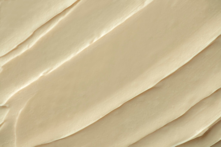 Foto grátis close-up do fundo com textura de glacê creme