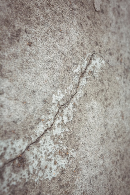 Close-up do muro de cimento com rachadura