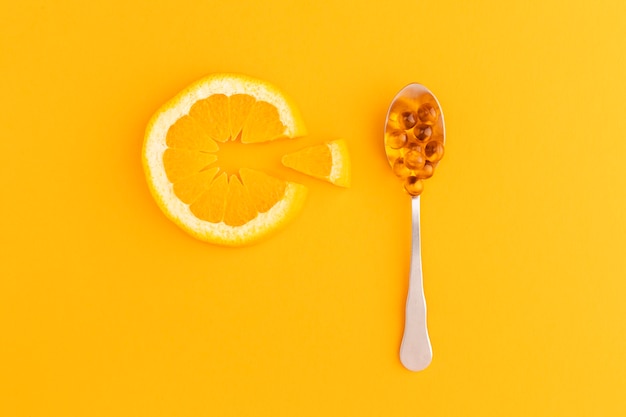 Close-up em complementos alimentares com laranja
