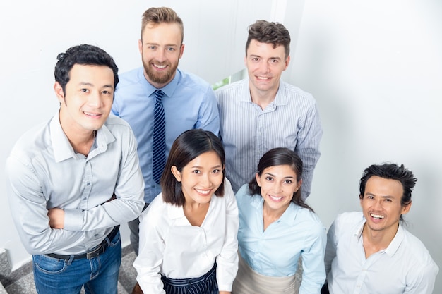 Closeup Portrait of Smiling Business Team em Stairway