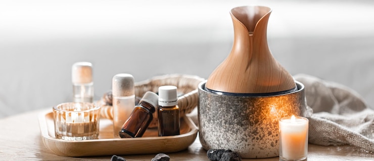 Foto grátis composição de spa com umidificador de ar e óleos aromáticos