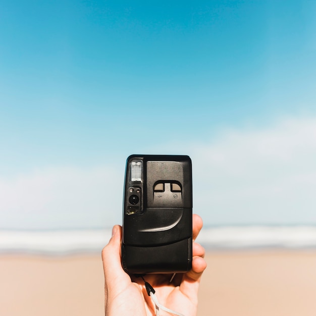 Foto grátis conceito de praia com câmera